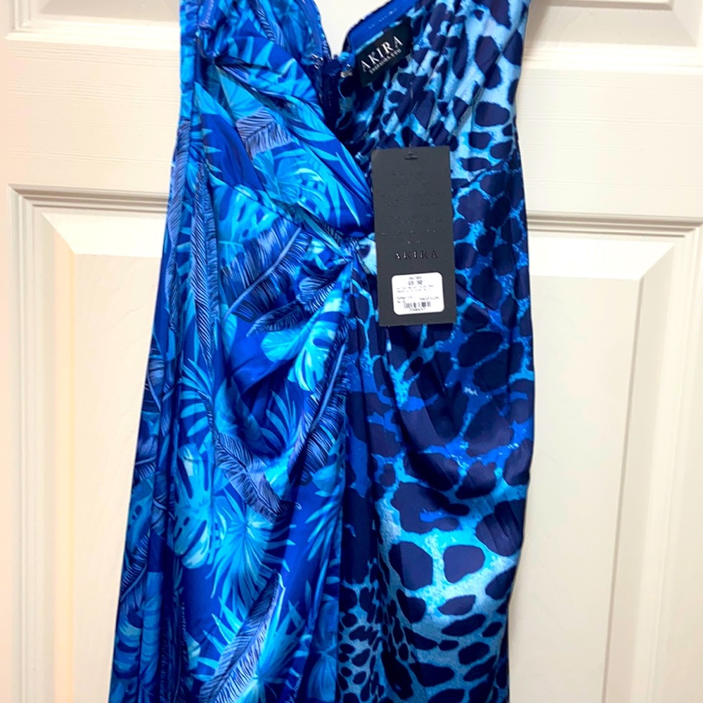 Maxi dress, w/ multiple shades of blue and designs. There’s a skirt underneath.